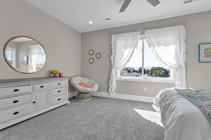 Recessed lighting, ceiling fan, and carpeted flooring