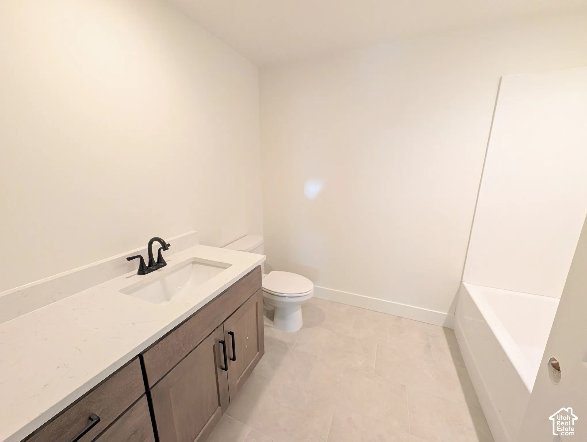 White solid surface countertop with an integrated rectangular sink