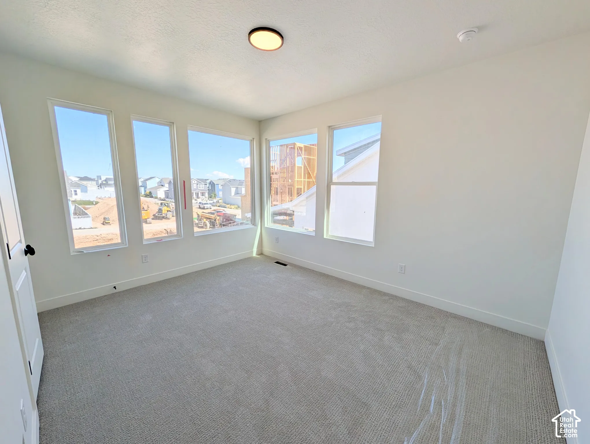 Light gray carpeting paired with white walls