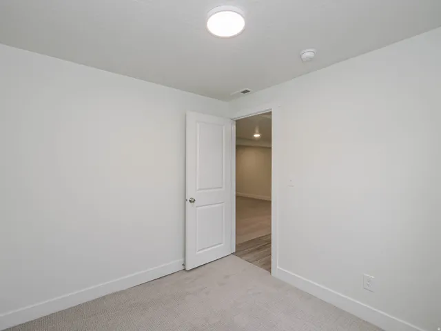 Neutral color palette with carpeted flooring