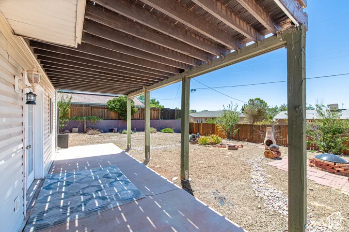 Covered patio with a concrete surface and exterior lighting
