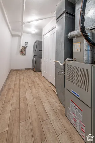 Wood-finish flooring, utility room, white bi-fold doors, white walls