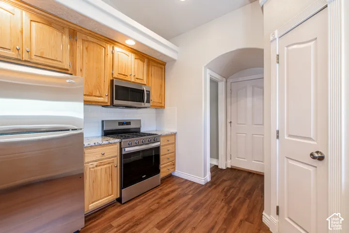 Wood-finish flooring with arched entryway
