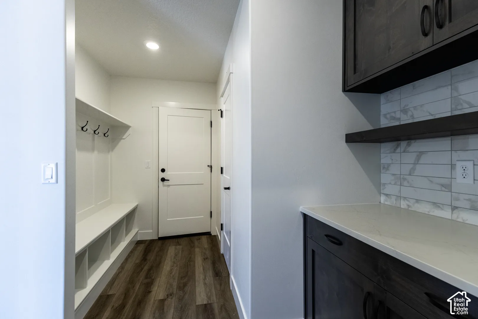 Mudroom with built-in bench seating and storage cubbies