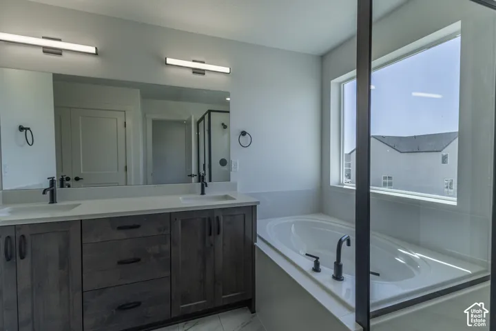Dual vanity with undermount sinks and dark wood-finish cabinetry