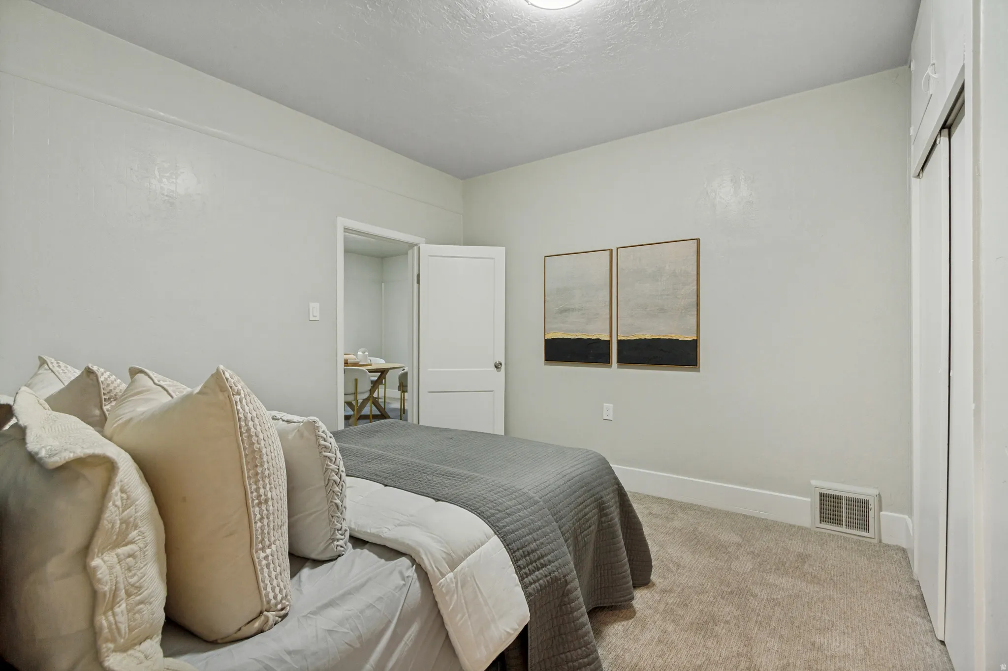 Wall-to-wall carpeting and white trim throughout