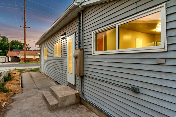 Gray horizontal siding exterior with multiple windows