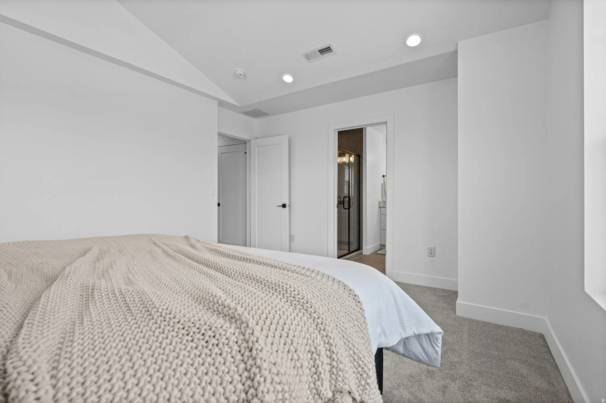 Recessed lighting, white walls, and gray carpeting