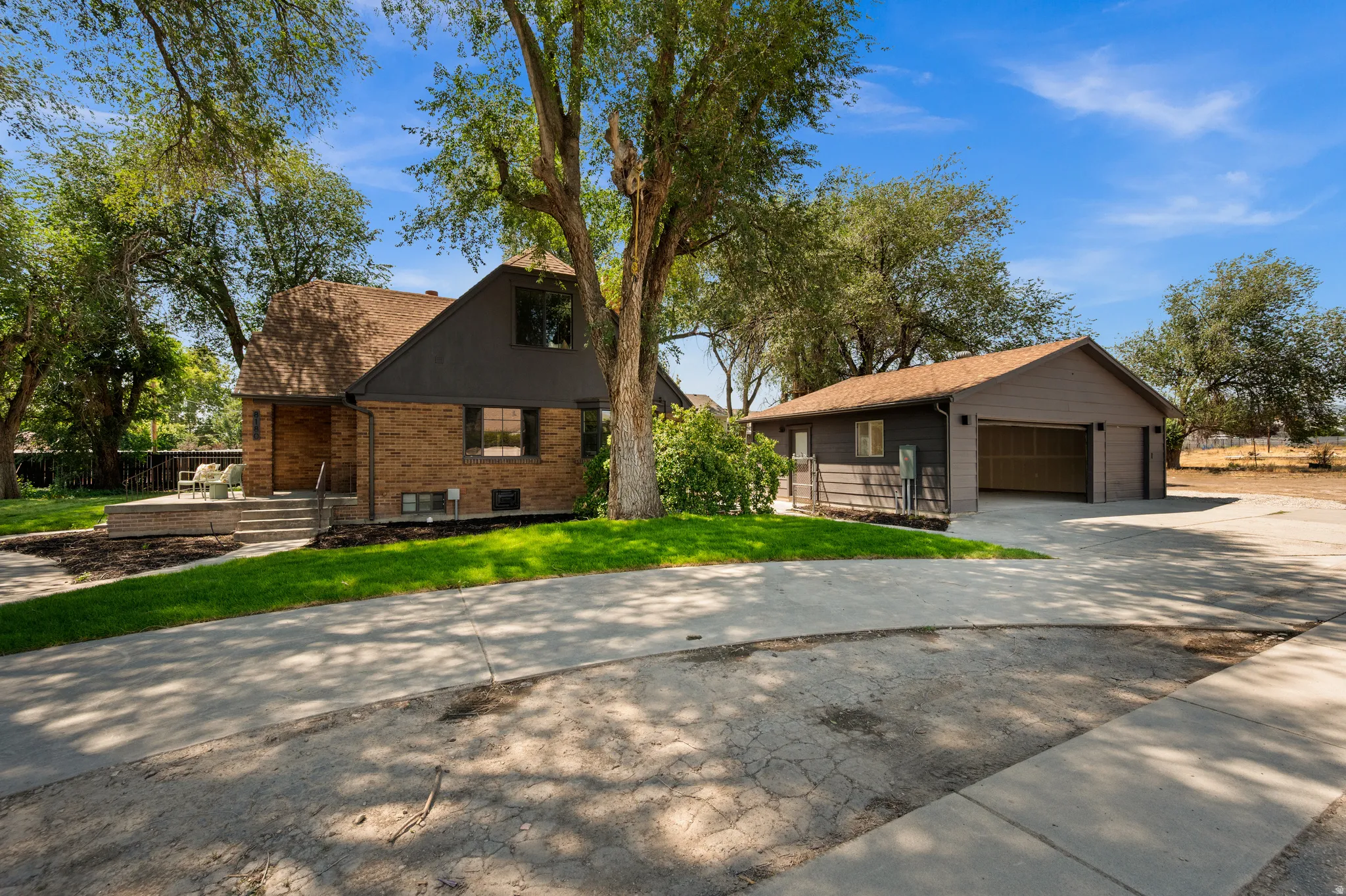 Brick and siding exterior with a shingled roof