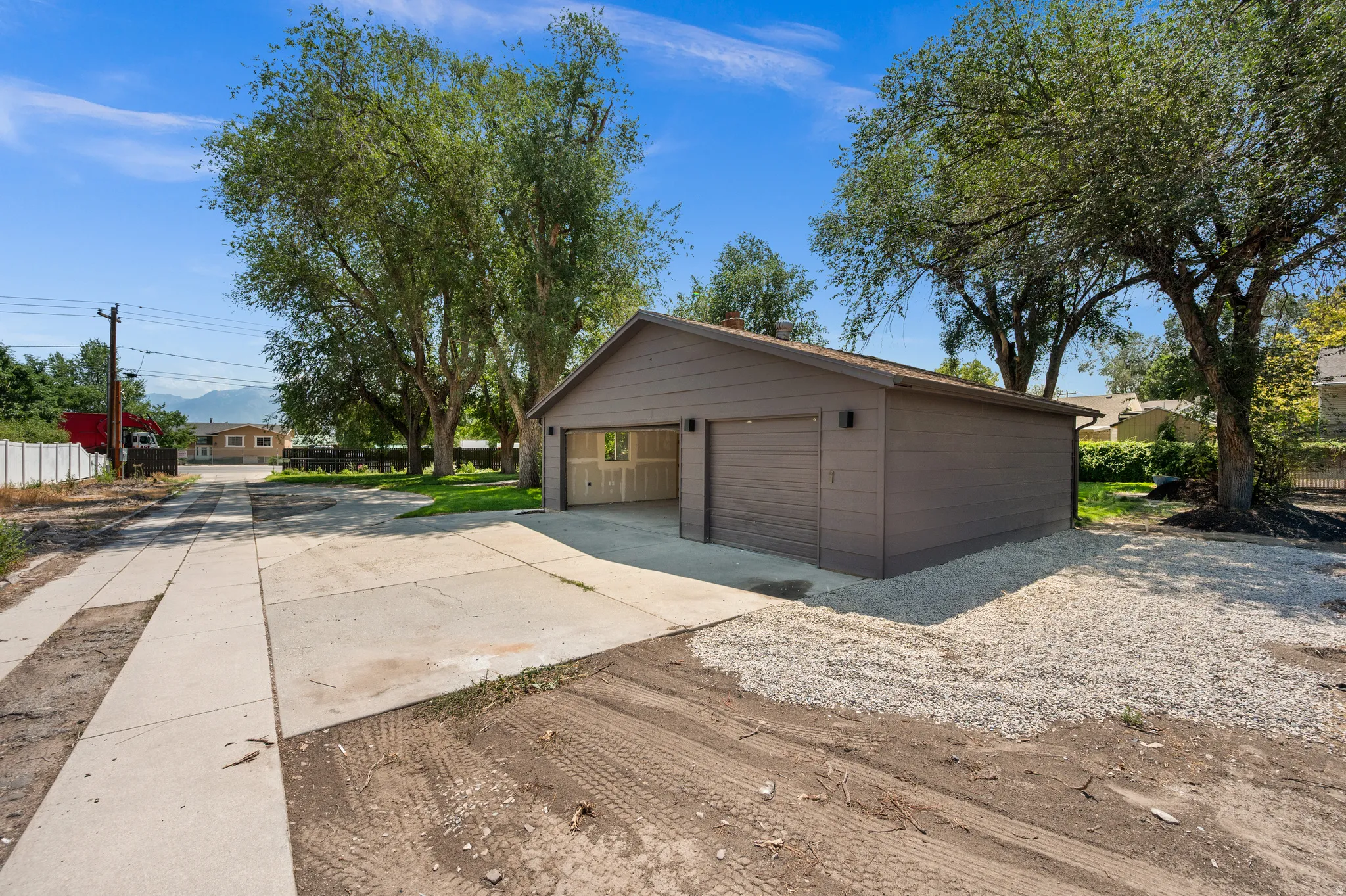 Detached two-car garage with horizontal siding