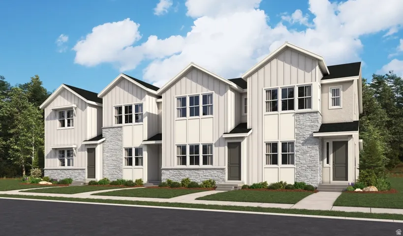 Modern farmhouse-style townhome featuring vertical board-and-batten siding, stone accents, and peaked gable rooflines