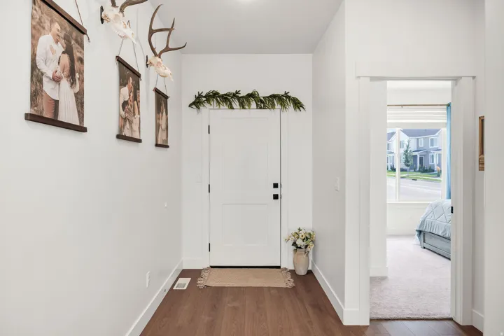 White paneled door with black hardware