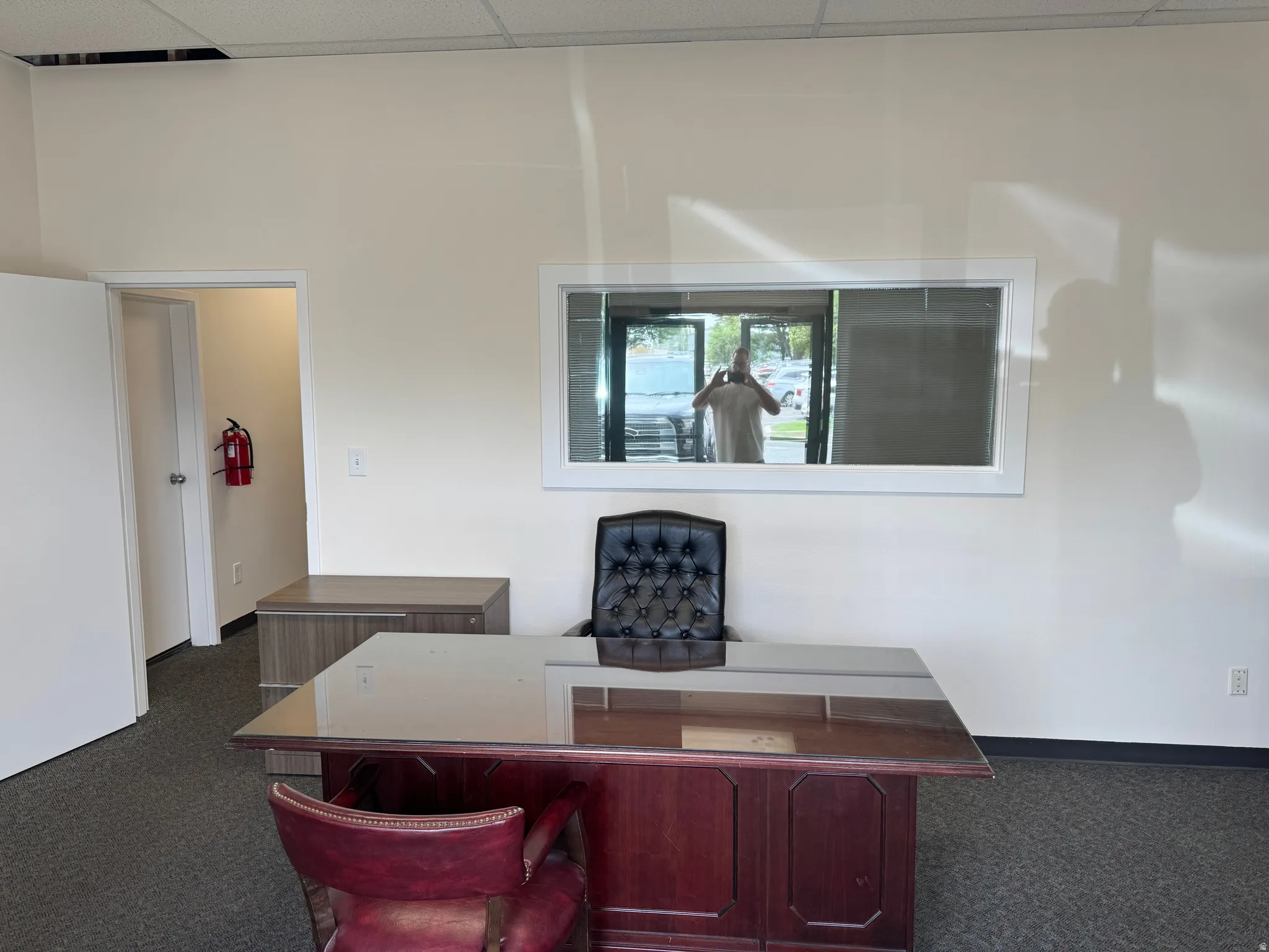 Front reception area with window into private office.