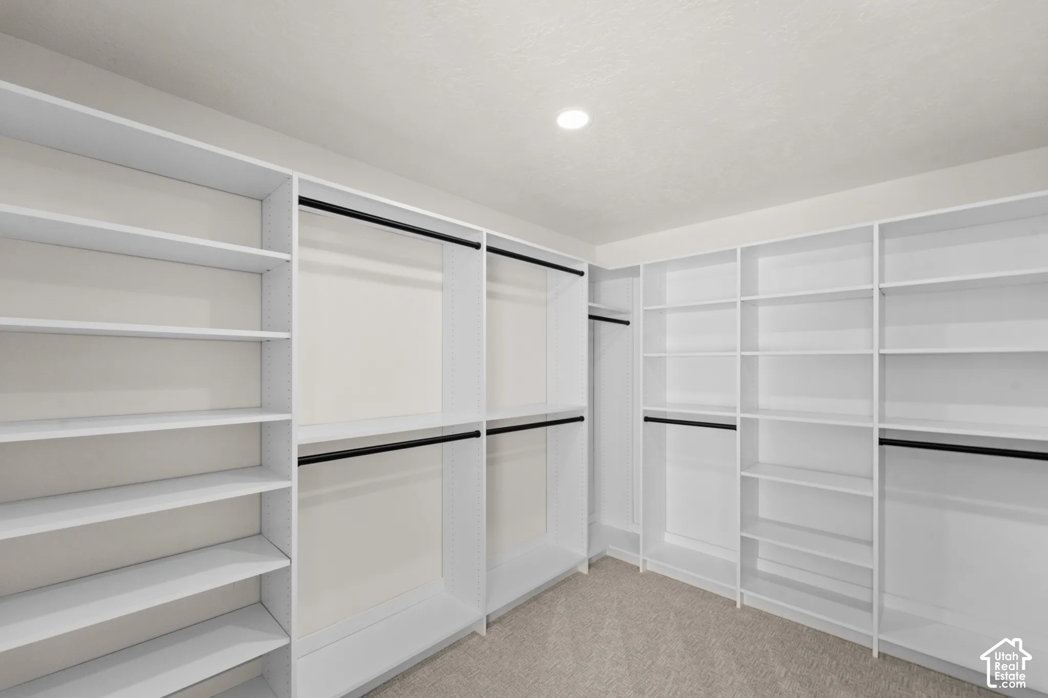 Built-in closet system with shelving and hanging rods