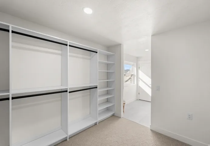 Built-in closet system with shelving and hanging rods