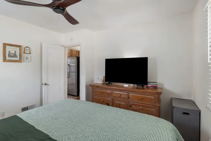 Ceiling fan with dark-toned blades