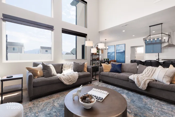 Expansive living area with soaring ceilings and large windows