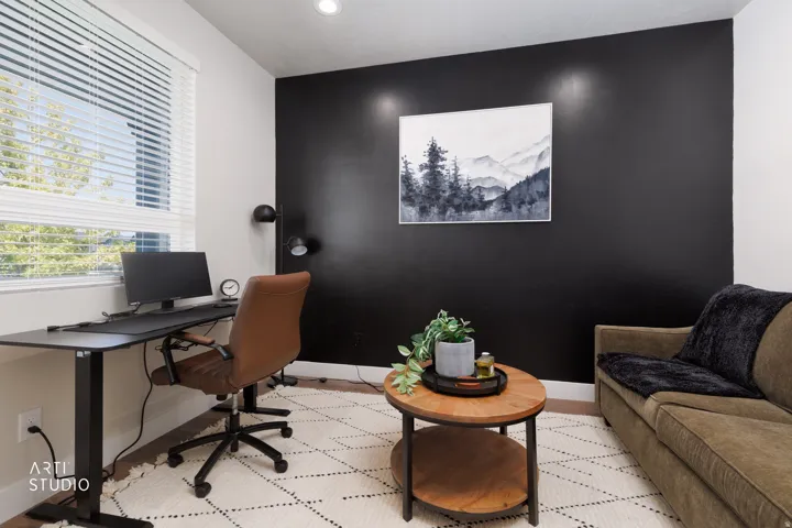 Recessed lighting, wood-finish flooring, and a large window with blinds