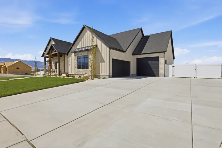 Modern farmhouse exterior with board and batten siding and stone accents
