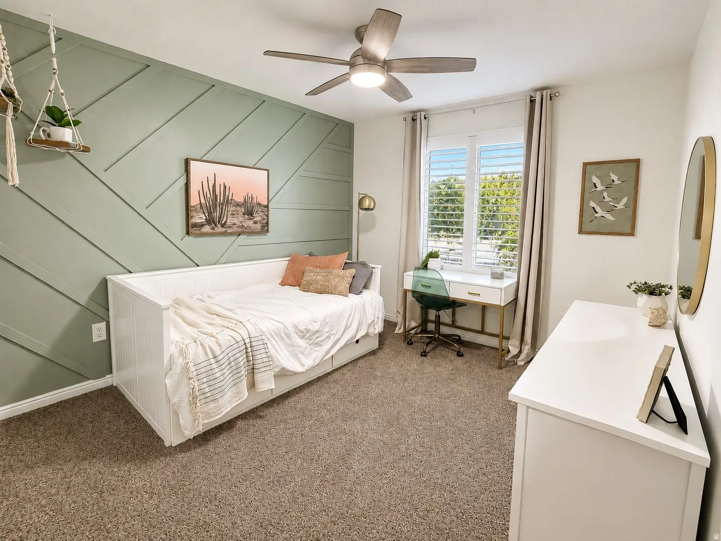 Decorative accent wall with paneling, window with plantation shutters, ceiling fan with integrated lighting, and carpet flooring