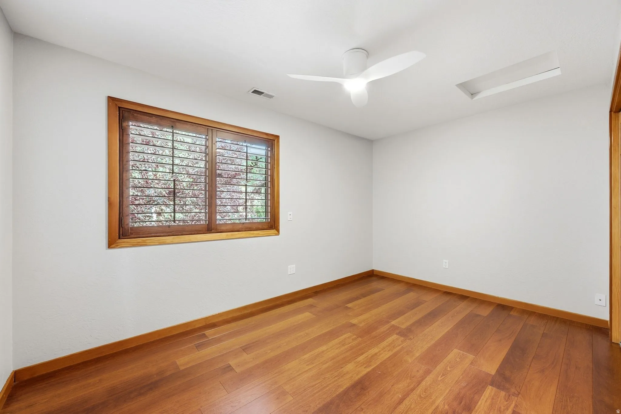 3rd upper level bedroom with hardwood floors and ample closet space.