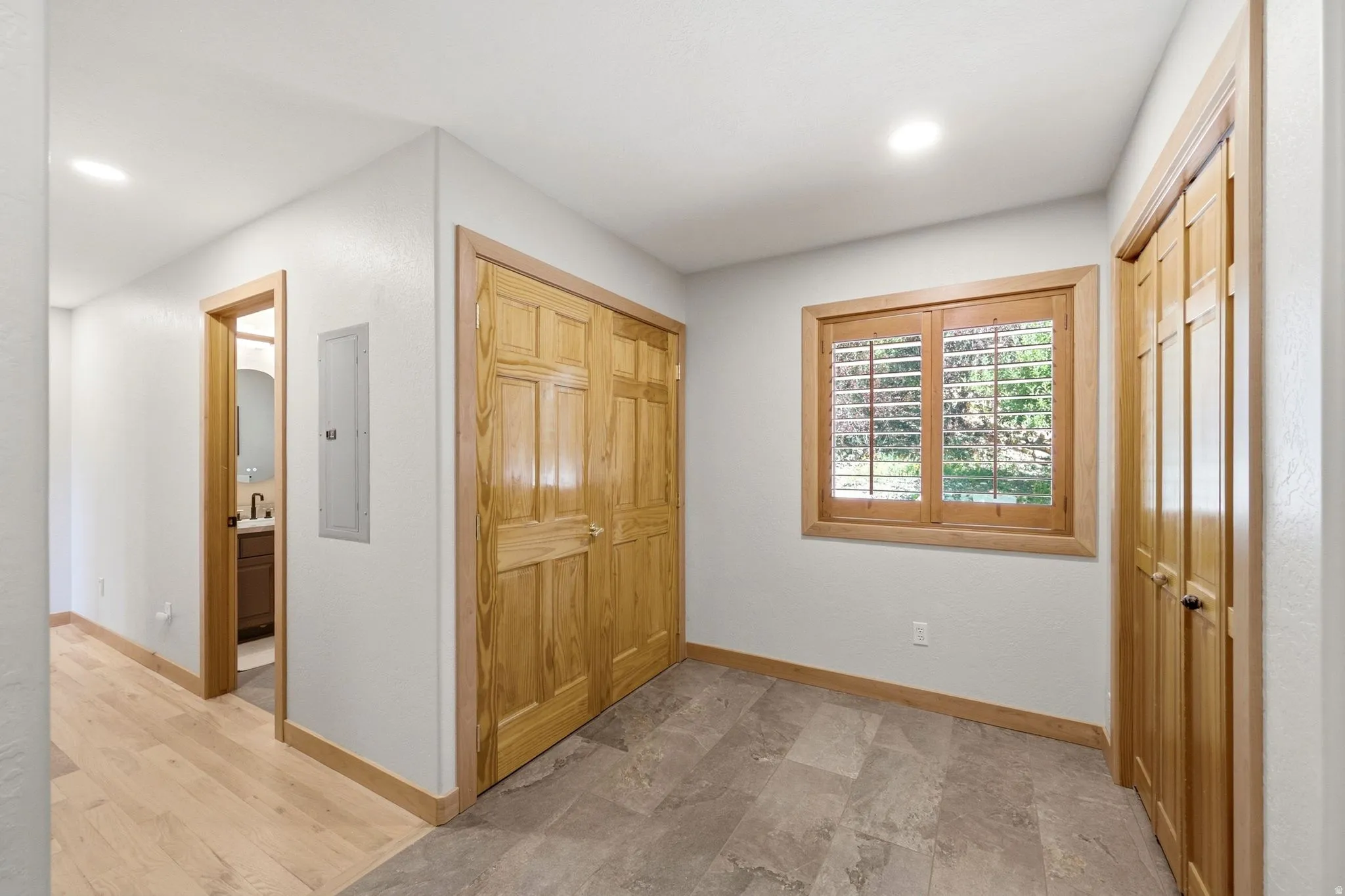 Mudroom with ample storage and heated floors right off of the garage entrance into the home.