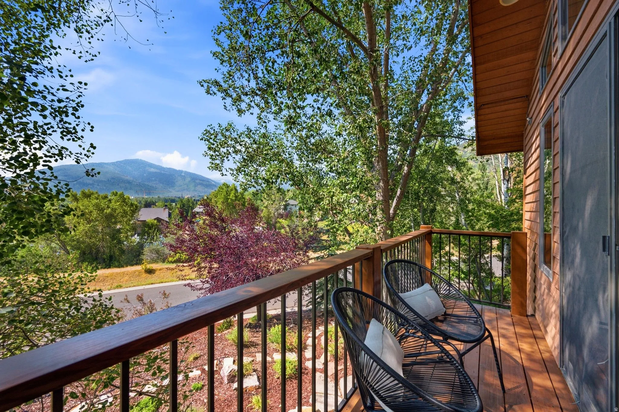 Private balcony with views of the mountains and ski resorts right in the comfort of your primary suite!