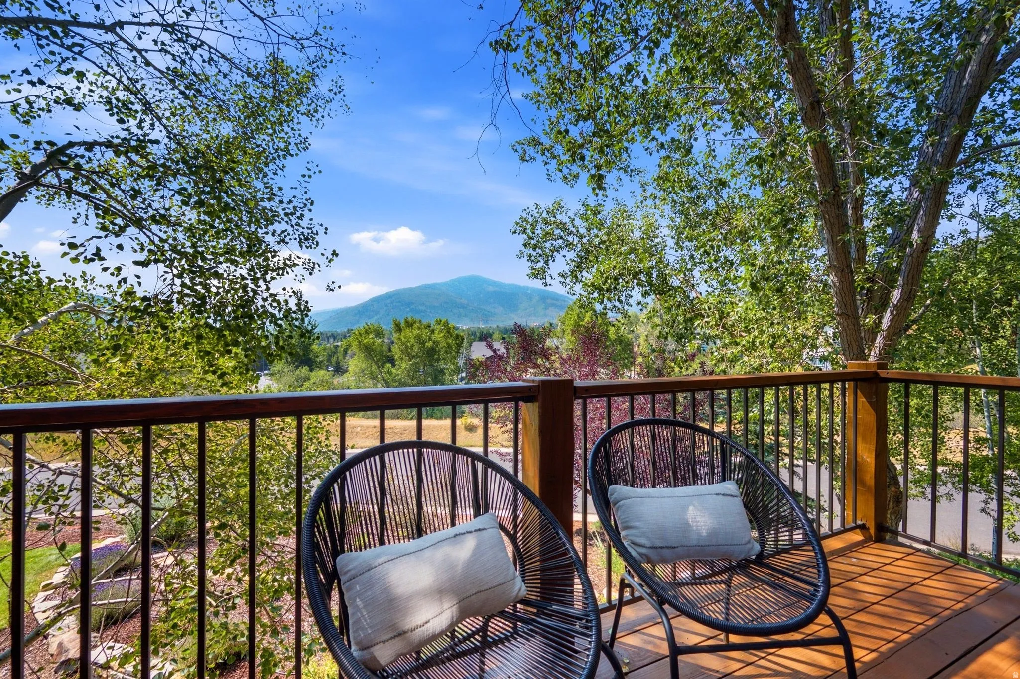Private balcony with views of the mountains and ski resorts right in the comfort of your primary suite!
