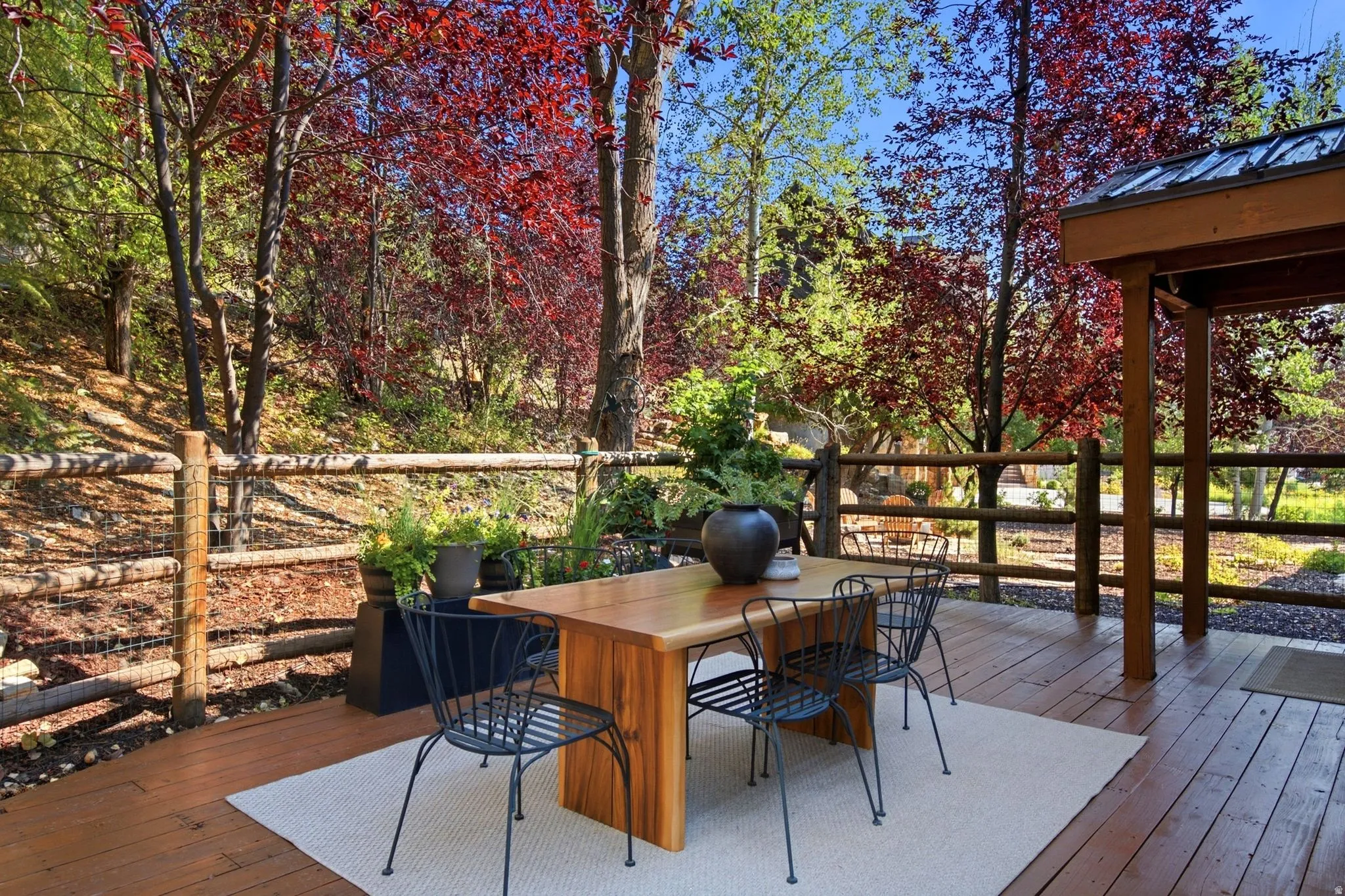 Secluded and private back deck right off the kitchen and dining room with multiple seating areas for entertaining, relaxing, working from home, and being immersed in nature.  The home often sees moose, deer, rabbits, squirrels, birds and less commonly elk