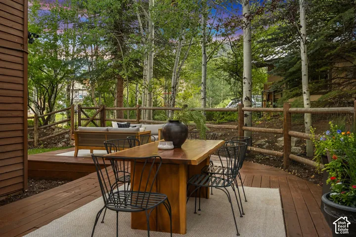 Secluded and private back deck right off the kitchen and dining room with multiple seating areas for entertaining, relaxing, working from home, and being immersed in nature.  The home often sees moose, deer, rabbits, squirrels, birds and less commonly elk