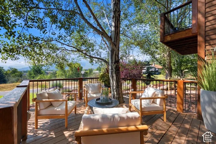 Front deck with a tree integrated into the deck and stunning views of Park City, Canyons, and Deer Valley. Imagine watching the fireworks from your front deck!