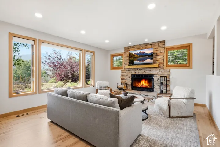 Updated lighting, refinished wood floors, and a cozy fireplace so you can sit in your home and enjoy all the views out your large picture window while being bathed in natural light.