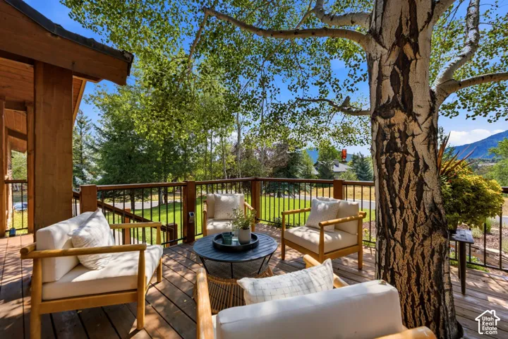 Front deck with a tree integrated into the deck and stunning views of Park City, Canyons, and Deer Valley. Imagine watching the fireworks from your front deck!