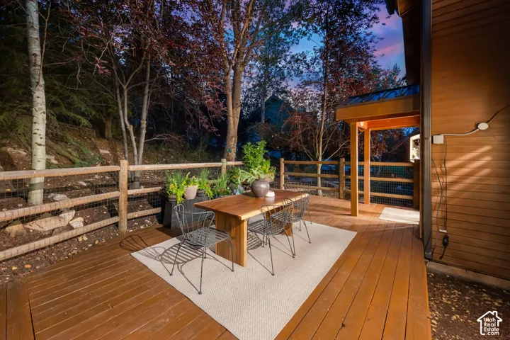 Secluded and private back deck right off the kitchen and dining room with multiple seating areas for entertaining, relaxing, working from home, and being immersed in nature.  The home often sees moose, deer, rabbits, squirrels, birds and less commonly elk
