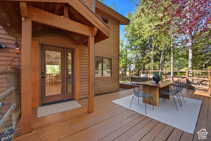 Secluded and private back deck right off the kitchen and dining room with multiple seating areas for entertaining, relaxing, working from home, and being immersed in nature.  The home often sees moose, deer, rabbits, squirrels, birds and less commonly elk