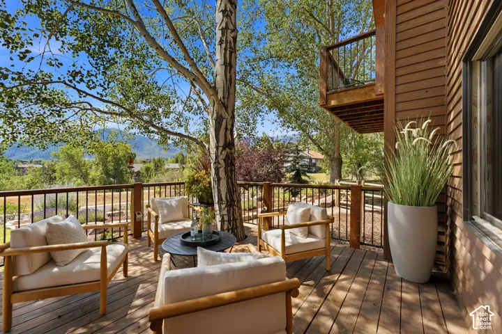 Front deck with a tree integrated into the deck and stunning views of Park City, Canyons, and Deer Valley. Imagine watching the fireworks from your front deck!