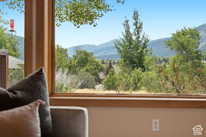 Large picture window with natural wood trim framing a mountain your views of Park City.  You can see fireworks from the Canyons Village and Park City mountain resorts without ever leaving your living room or front porch!