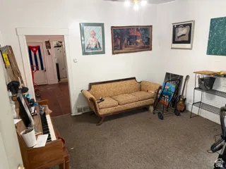 Unit 2 living room featuring carpet floors.