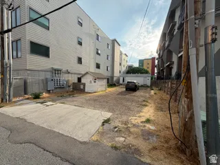 Gravel lot with concrete pad.
