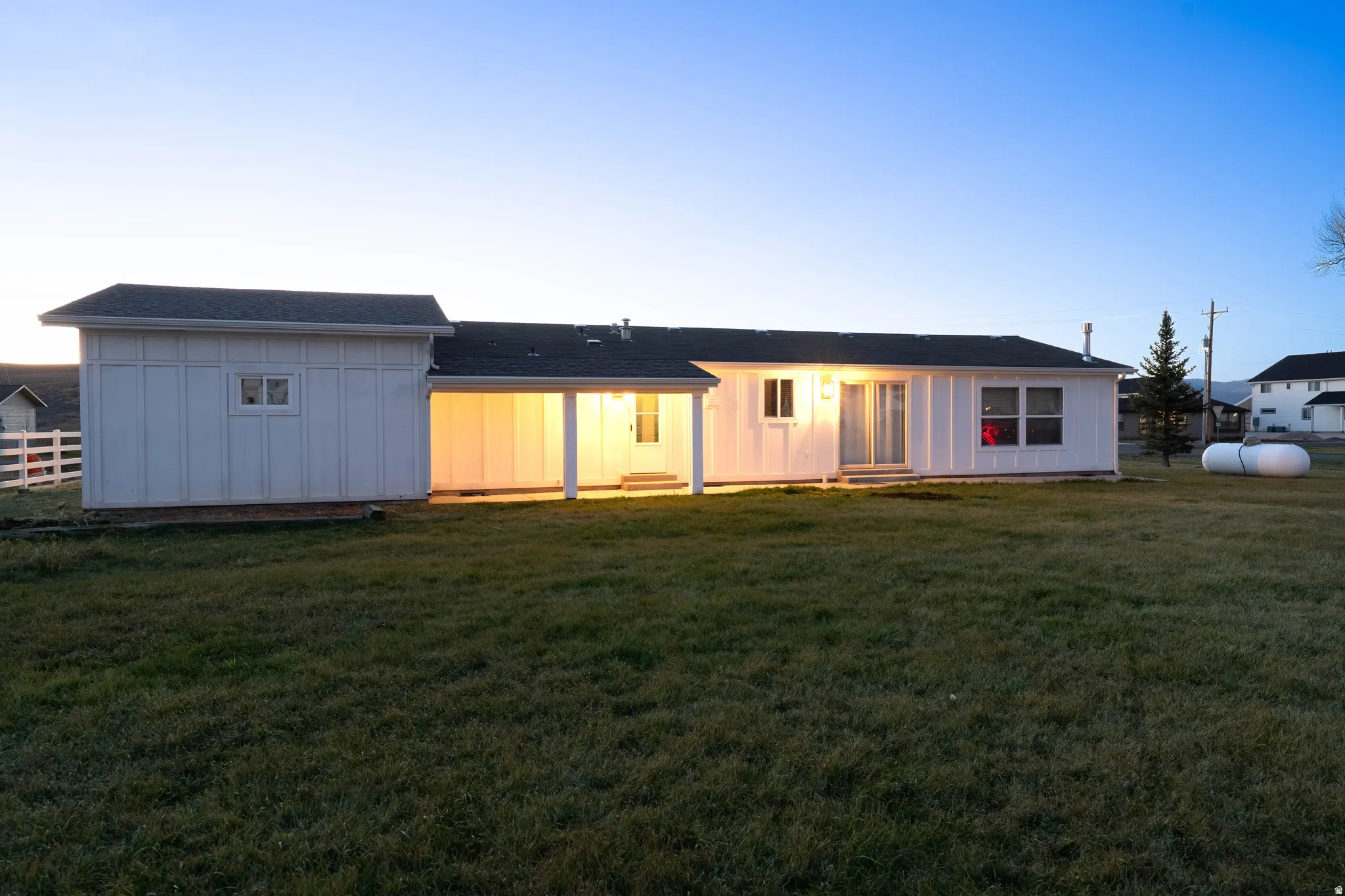 White board and batten exterior with covered patio