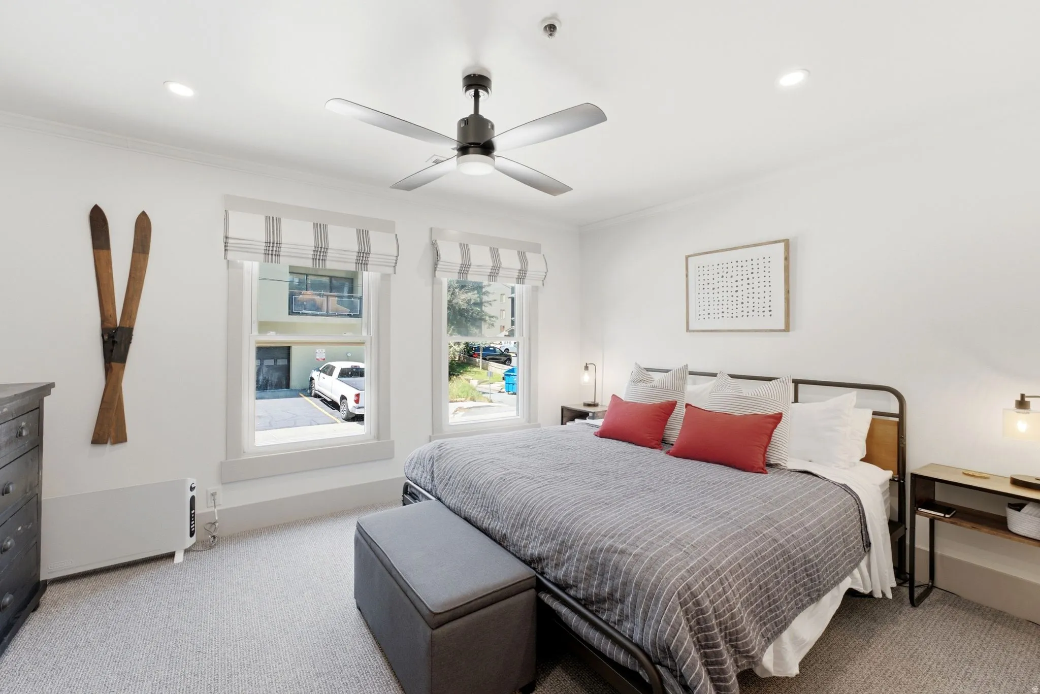 White walls, recessed lighting, and a ceiling fan with integrated lighting
