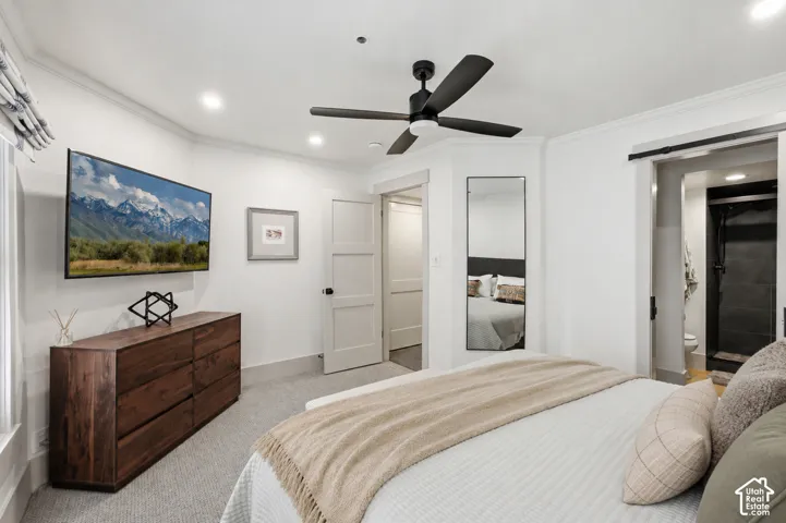 Recessed lighting, crown molding, and a ceiling fan with integrated lighting