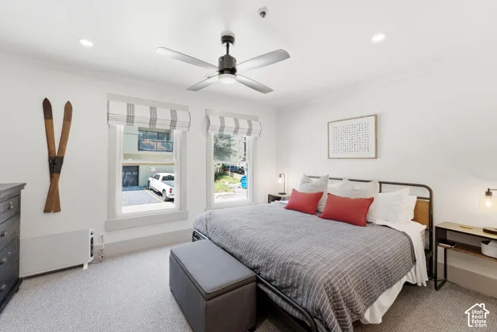 White walls, recessed lighting, and a ceiling fan with integrated lighting