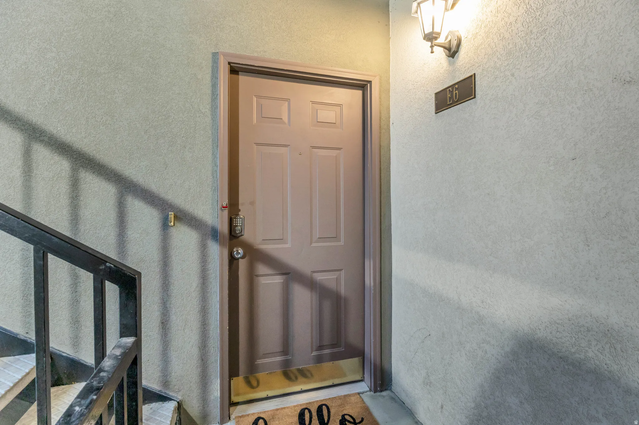 Panel-style entry door with integrated deadbolt and handle