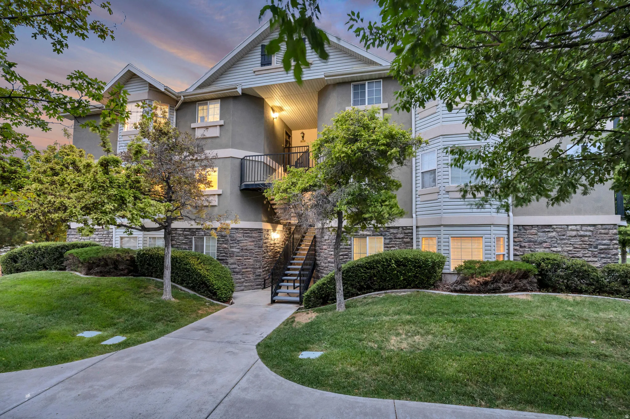 Multi-level building with stone veneer and siding facade