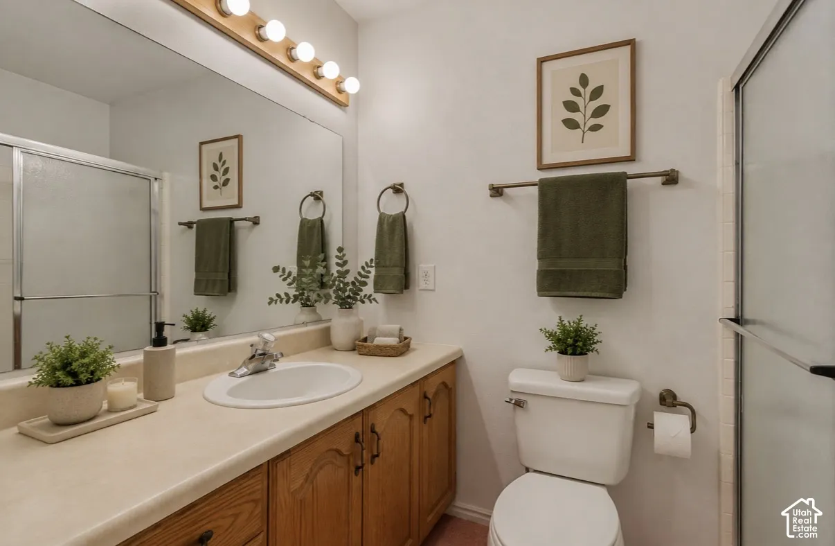 Primary bathroom.Light-toned vanity with wood-finish cabinetry, a large wall-mounted mirror, and a shower with a sliding glass door