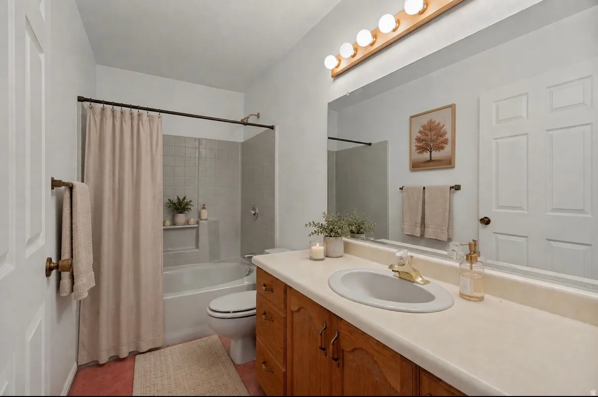 Bathtub with tiled surround, wood-finish vanity with an integrated sink, and a large wall-mounted mirror