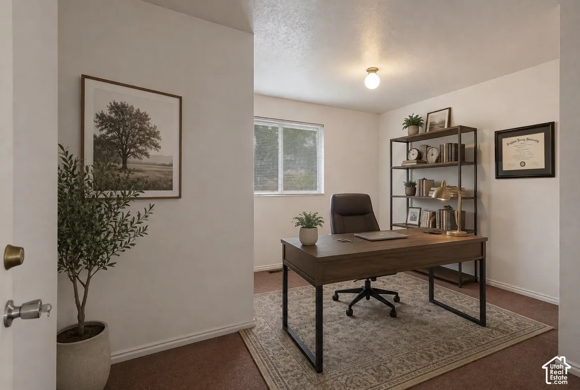 Bedroom being used as office. Room featuring a single window, a ceiling-mounted light fixture, closet space, and light-colored walls.