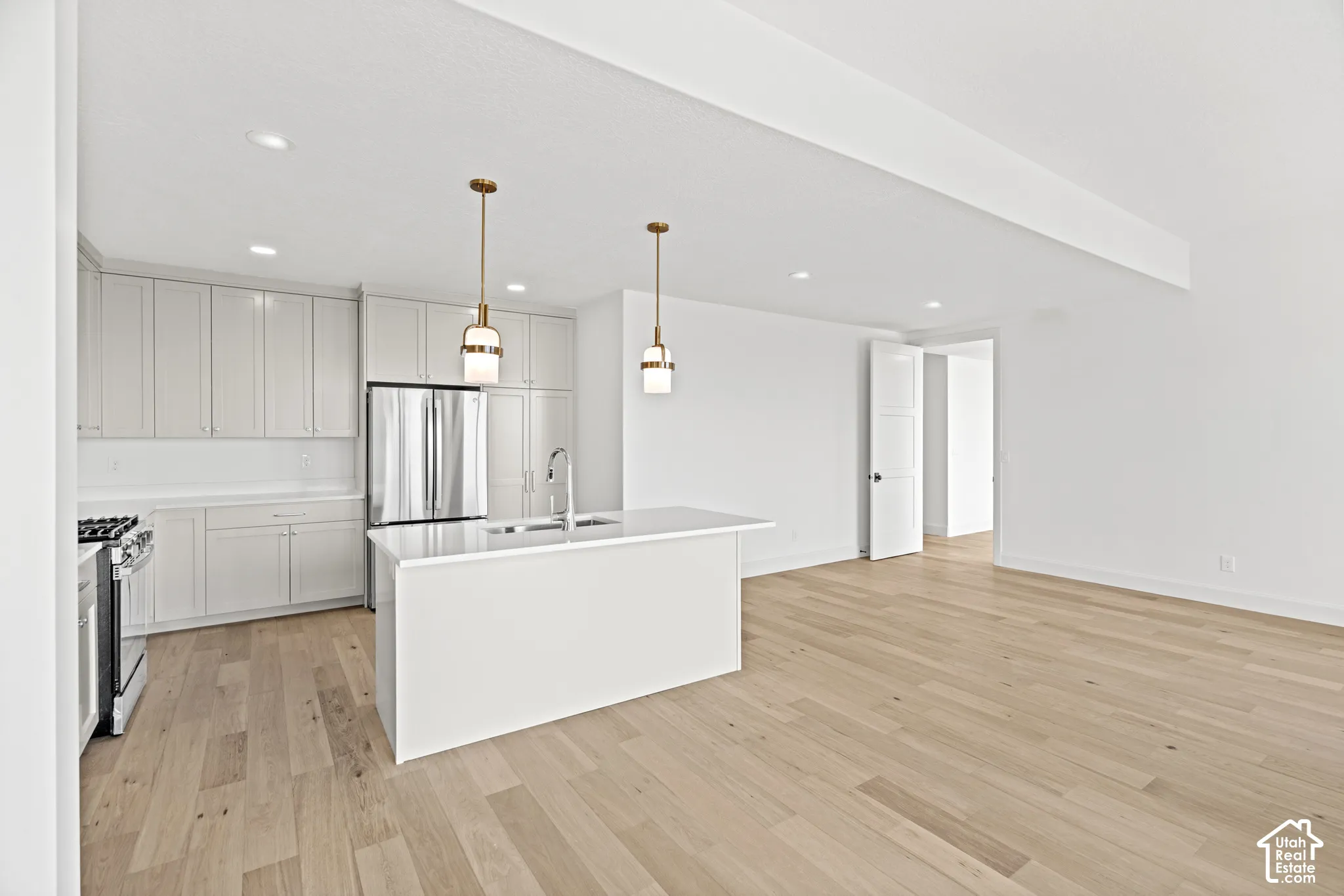 Open-concept living space with wood-finish flooring