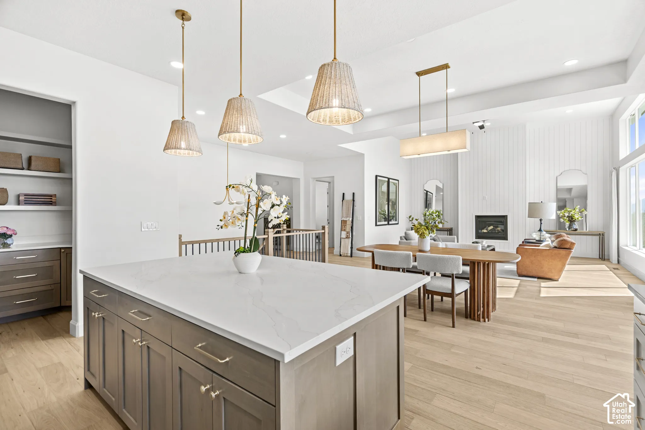 White quartz countertop island with integrated cabinetry